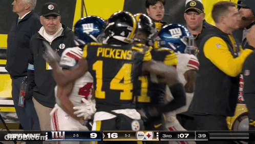 A Football Player With The Number 14 On His Back GIF