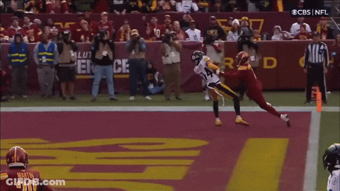 A Football Player With The Number 14 On His Jersey GIF