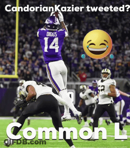 A Football Player With The Number 14 On His Jersey Catching A Ball GIF