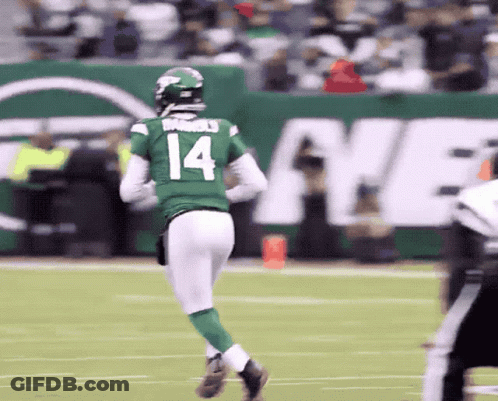 A Football Player With The Number 14 On His Jersey Is Running On The Field GIF