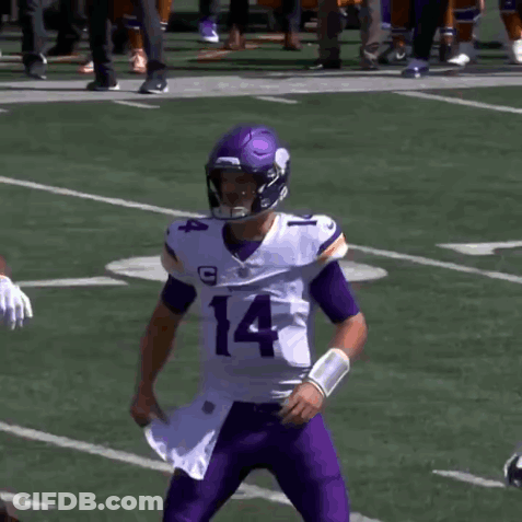 A Football Player With The Number 14 On His Jersey Stands Next To Another Player GIF