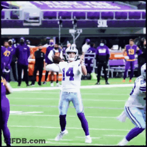 A Football Player With The Number 14 On His Jersey Throws A Pass GIF