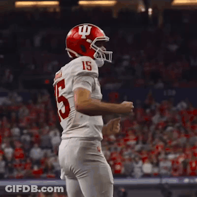 A Football Player With The Number 15 On His Jersey Is Dancing GIF