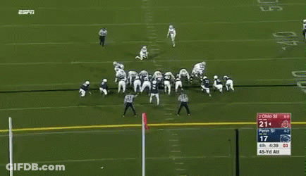 A Football Player With The Number 15 On His Jersey Is Running On The Field GIF