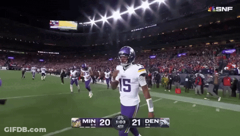 A Football Player With The Number 15 On His Jersey Walks Off The Field GIF