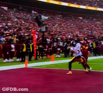 A Football Player With The Number 17 On His Jersey Is Running With The Ball GIF