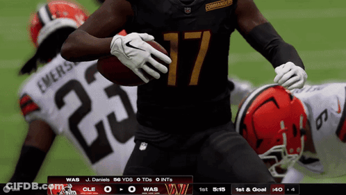 A Football Player With The Number 17 On His Jersey Is Running With The Ball GIF