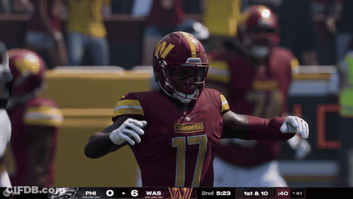 A Football Player With The Number 17 On His Jersey Stands On The Field GIF