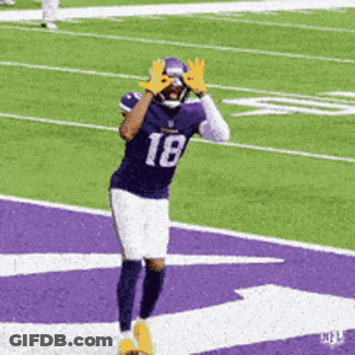A Football Player With The Number 18 On His Jersey Is Running On A Field GIF