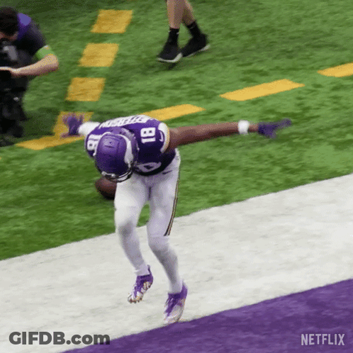A Football Player With The Number 18 On His Jersey Is Running On The Field GIF
