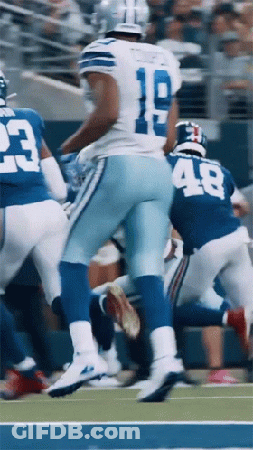 A Football Player With The Number 18 On His Jersey Runs On The Field GIF