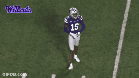 A Football Player With The Number 19 On His Jersey Is Jumping In The Air GIF