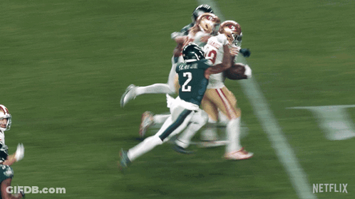 A Football Player With The Number 19 On His Jersey Is Running On The Field GIF
