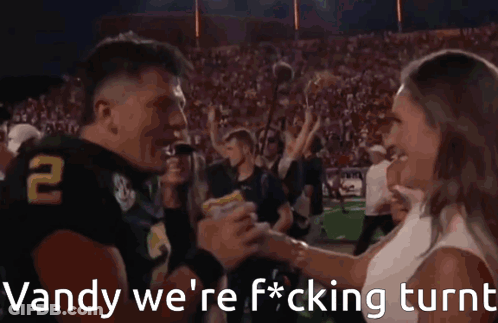 A Football Player With The Number 2 On His Jersey Is Being Interviewed By A Reporter GIF