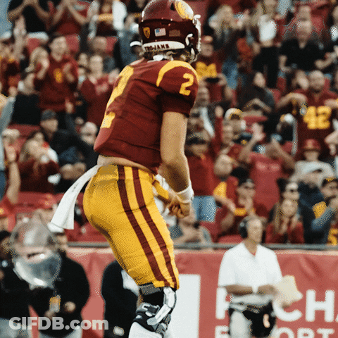 A Football Player With The Number 2 On His Jersey Is Running On The Field GIF