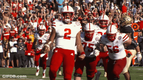 A Football Player With The Number 2 On His Jersey Is Running On The Field GIF