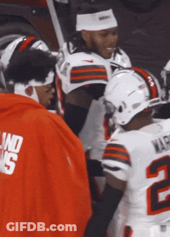 A Football Player With The Number 2 On His Jersey Is Talking To Another Player GIF