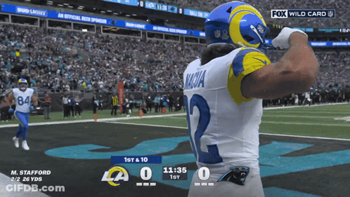 A Football Player With The Number 2 On His Jersey Stands On The Field GIF