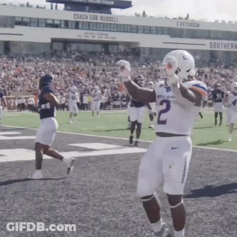 A Football Player With The Number 2 On His Jersey Stands On The Field GIF