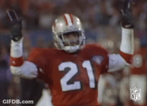 A Football Player With The Number 21 On His Jersey Is Celebrating GIF