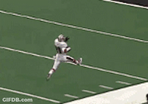A Football Player With The Number 21 On His Jersey Is Running On A Field GIF