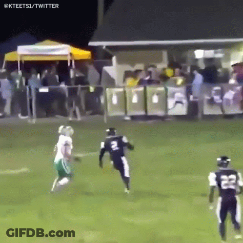 A Football Player With The Number 22 On His Jersey Is Running On The Field GIF