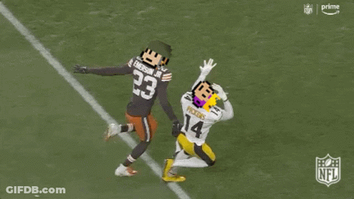 A Football Player With The Number 23 On His Jersey Is Being Tackled By Another Player GIF