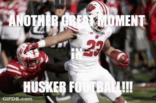 A Football Player With The Number 23 On His Jersey Runs With The Ball GIF