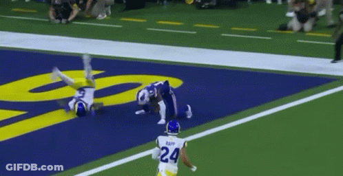 A Football Player With The Number 24 On His Back Is Running On The Field GIF