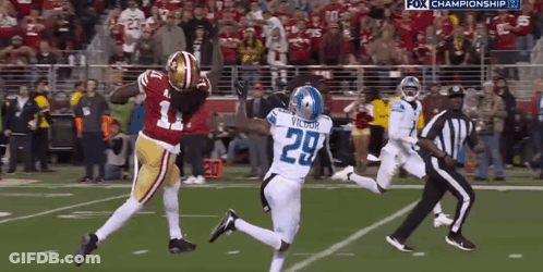 A Football Player With The Number 29 On His Jersey Is Running On The Field GIF