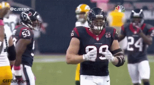 A Football Player With The Number 29 On His Jersey Stands On The Field . GIF
