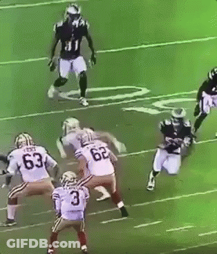 A Football Player With The Number 3 On His Jersey Is Being Tackled By Another Player GIF