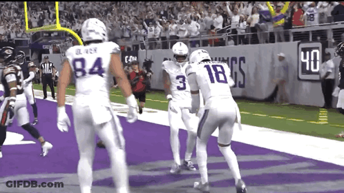 A Football Player With The Number 3 On His Jersey Stands On The Field GIF