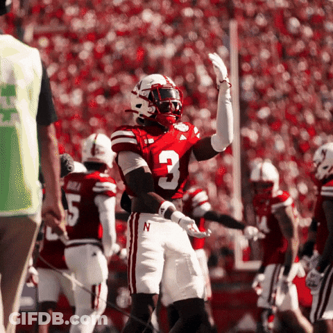A Football Player With The Number 3 On His Jersey Stands On The Field GIF