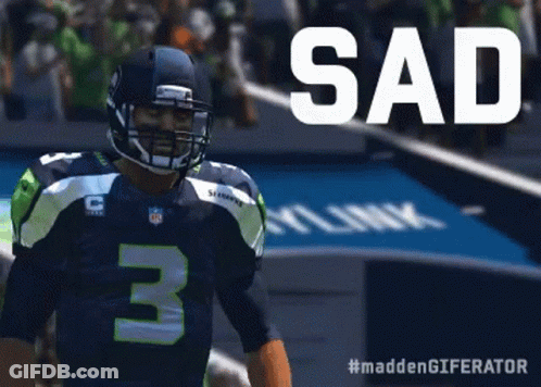 A Football Player With The Number 3 On His Jersey Stands On The Field GIF