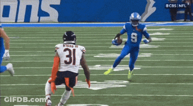 A Football Player With The Number 31 On His Jersey Runs With The Ball GIF