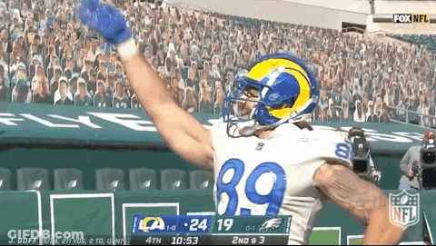 A Football Player With The Number 39 On His Jersey Celebrates A Touchdown GIF