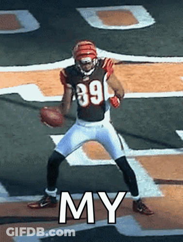 A Football Player With The Number 39 On His Jersey Holds A Football GIF