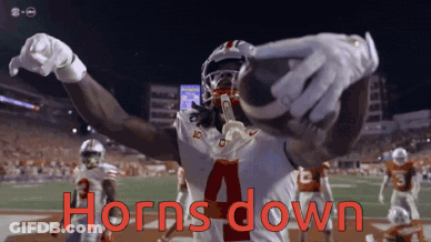 A Football Player With The Number 4 On His Jersey Holds A Football In His Hands GIF