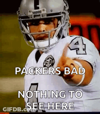A Football Player With The Number 4 On His Jersey Is Pointing At Something . GIF