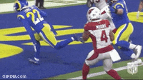 A Football Player With The Number 4 On His Jersey Is Running On The Field . GIF