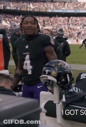 A Football Player With The Number 4 On His Jersey Is Standing On The Field GIF