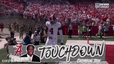 A Football Player With The Number 4 On His Jersey Stands On The Field GIF