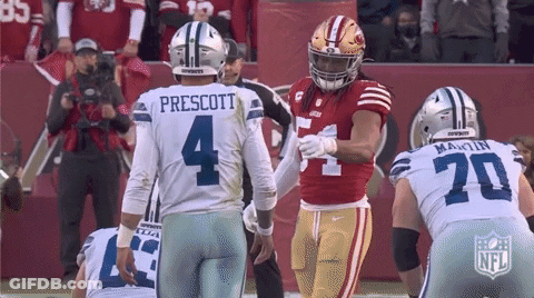 A Football Player With The Number 4 On His Jersey Talks To Another Player GIF