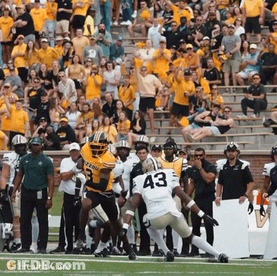 A Football Player With The Number 43 On His Jersey Jumps In The Air GIF