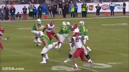 A Football Player With The Number 45 On His Jersey Is Being Tackled GIF