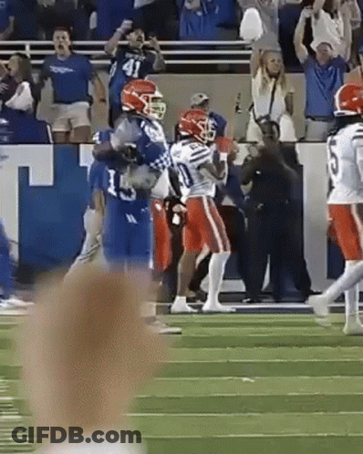 A Football Player With The Number 5 On His Jersey Runs On The Field GIF