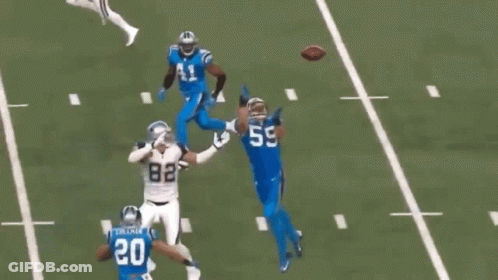 A Football Player With The Number 5 On His Jersey Runs With The Ball GIF
