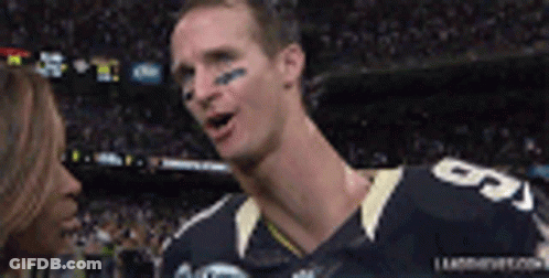 A Football Player With The Number 5 On His Jersey Talking To A Woman GIF