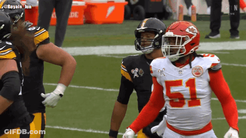 A Football Player With The Number 51 On His Jersey Stands On The Field GIF